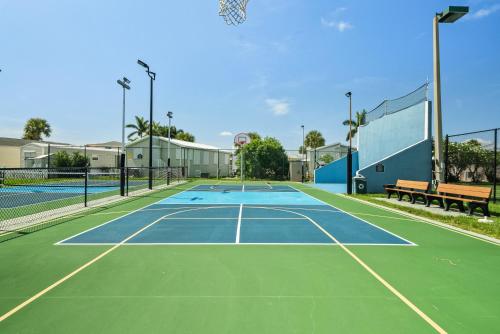 a tennis court with a bench on top of it at Nettles Island 1383 in Jensen Beach
