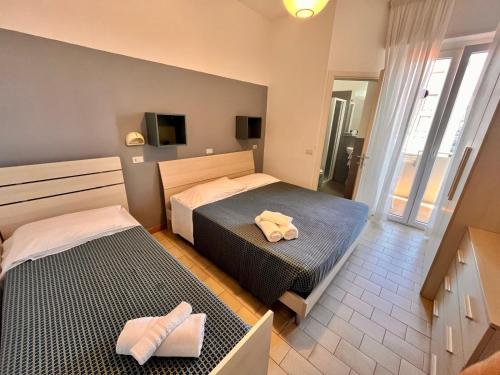 Postel nebo postele na pokoji v ubytování Hotel Atlas