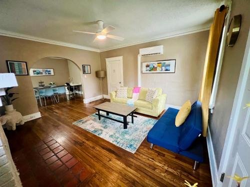 a living room with a blue couch and a table at Sweet Stay in Memphis in Memphis
