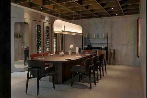 a dining room with a large table and chairs at Il Boscareto Resort & Spa in Serralunga d'Alba