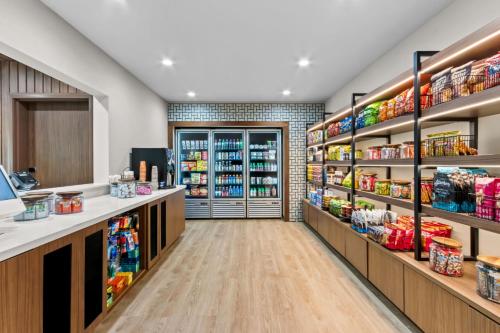 a grocery store aisle with shelves of food at Everhome Suites Ocala I-75 North in Ocala