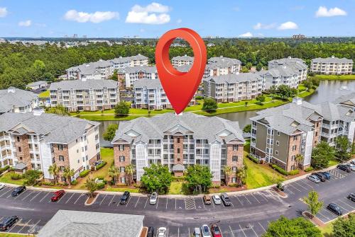a large red marker over a city with houses at Myrtlewood by Monarch Rentals in Myrtle Beach
