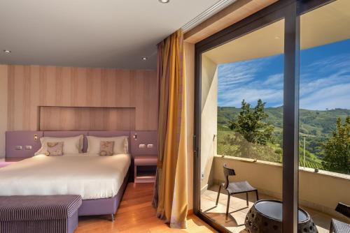 Postel nebo postele na pokoji v ubytování Il Boscareto Resort & Spa