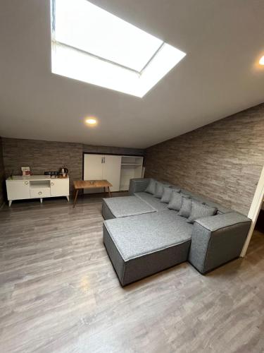 a bedroom with a bed and a skylight at La Vie Suite Hotel in Istanbul