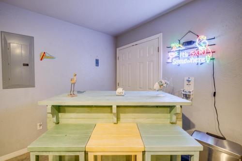 a room with a table and a sign on the wall at Modern Retreat with Gas Grill - Walk to Lake Texoma! in Kingston