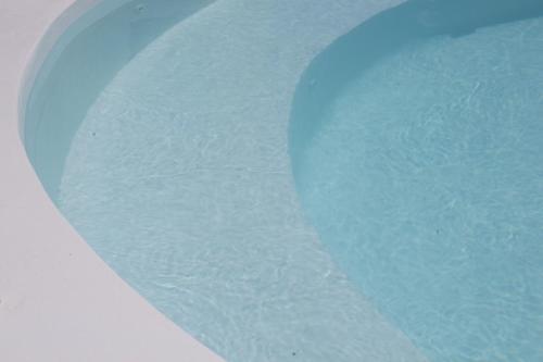 a close up of a toilet bowl with water at Byzantio Beach Suites & Wellness in Agios Sostis