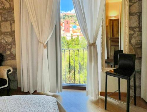 En eller flere senge i et værelse på Bosa Eye House 1873