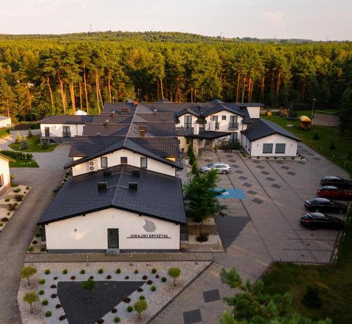 an aerial view of a house with a parking lot at Jurajski Kryształ in Zaborze