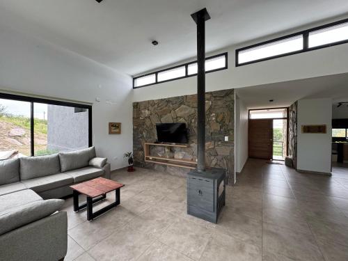 TV a/nebo společenská místnost v ubytování Sierras de Córdoba Ascochinga vivienda exclusiva