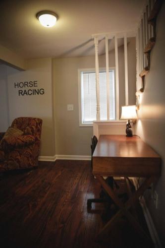 a living room with a table and a couch at 1939 Four Bed Rustic Escape by Casino in Ranson