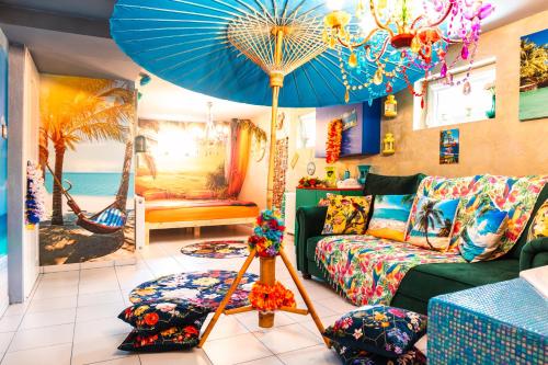 a living room with a couch and a blue umbrella at Princess Palace in Gdańsk