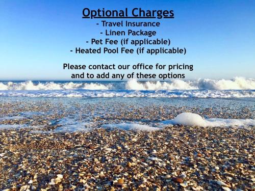 a picture of a beach with waves and rocks at Surf Condos 737 in Surf City