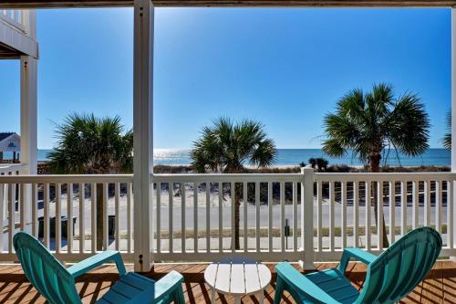 a view of the beach from a porch with chairs at Sea Star Village 322 in West Onslow Beach