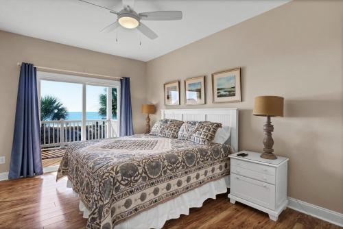 a bedroom with a bed and a window at Sea Star Village 322 in West Onslow Beach