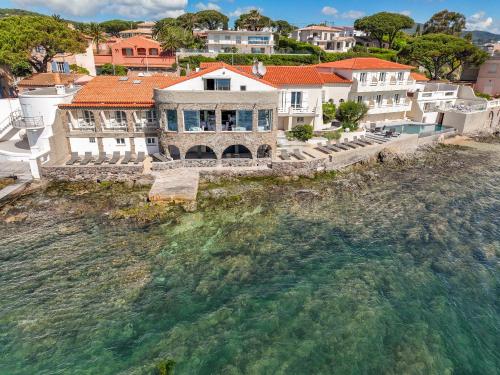 an aerial view of a house on the water at La Belle Aurore in Sainte-Maxime