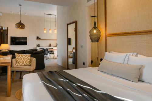 a bedroom with a bed and a living room at Ventus di Milo in Adamas