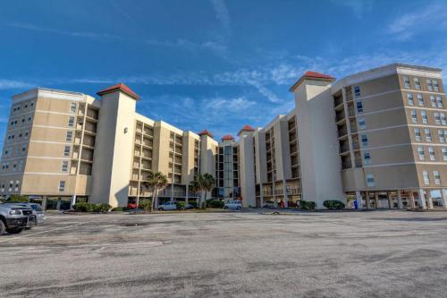 a large parking lot in front of a large building at St Regis 3303 in Chadwick Acres