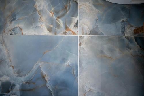 a collage of four pictures of marble at 3530 Island Drive in North Topsail Beach