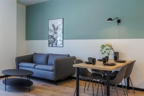 a living room with a couch and a table at River Stay Apartments in Tallinn