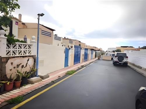 a street with a car parked in a parking lot at Apartamento Tanzanita in Costa Calma