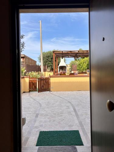 a view of a courtyard from a door at Mariella House in Fasano