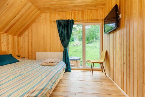 Ένα ή περισσότερα κρεβάτια σε δωμάτιο στο Cabana Magic Pine Nest