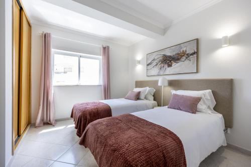 Giường trong phòng chung tại Lagos Town Lovers by Seewest