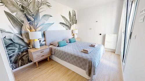 Posteľ alebo postele v izbe v ubytovaní Atico Buen Vivir en Marina Real II by Family Homes