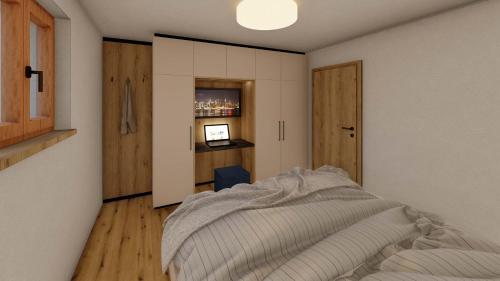 a bedroom with a bed and a desk at Appartements Täli in Lech am Arlberg