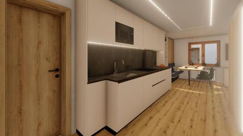a kitchen with a sink and a counter top at Appartements Täli in Lech am Arlberg