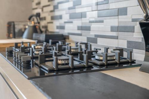 a black stove top oven sitting on top of a counter at Luxe 5 Bedroom Guardbridge House - St Andrews in St. Andrews