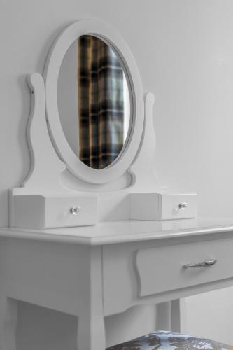 a bathroom with a mirror on a white counter at Luxe 5 Bedroom Guardbridge House - St Andrews in St. Andrews