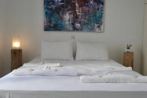 Ένα ή περισσότερα κρεβάτια σε δωμάτιο στο Mykonos Chora Apartment Near the Iconic Windmills