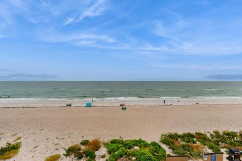 a view of a beach with people in the ocean at Belleair Beach Club 312 in Clearwater Beach