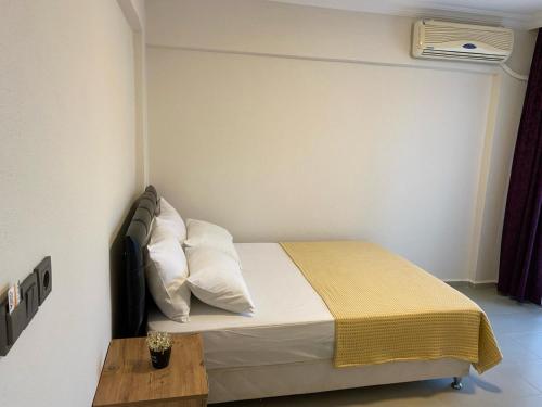 Postel nebo postele na pokoji v ubytování Ekin Assos