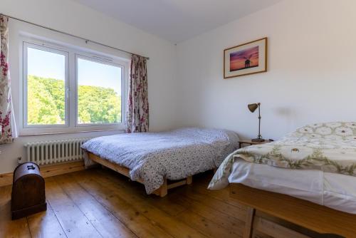 Ένα ή περισσότερα κρεβάτια σε δωμάτιο στο Large Family Home 23 min to Beach and New Forest