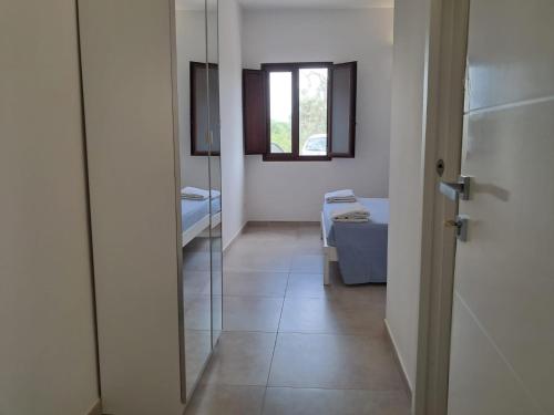 a hallway with a bathroom with a mirror at Agriturismo Tenuta La Siesta in Gallipoli