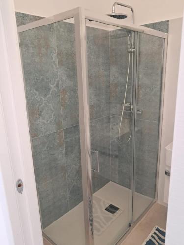 a shower with a glass door in a bathroom at Agriturismo Tenuta La Siesta in Gallipoli