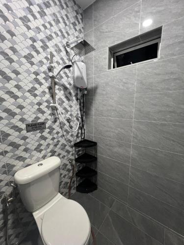 a bathroom with a toilet and a shower at KLIA HBO Villa Homestay in Nilai