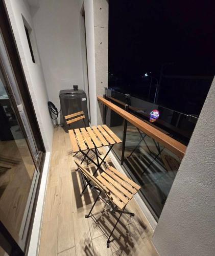a room with two chairs and a table with a large television at 隱 Villa 旅宿 in Chaozhou