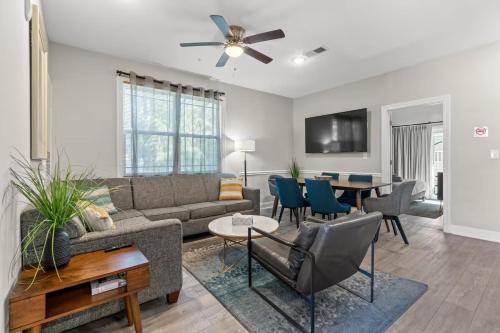a living room with a couch and a table at Modern 4BR Central Near Beach And Pier King Beds D in Myrtle Beach
