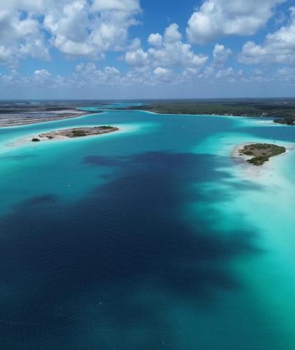 an aerial view of two islands in the water at Hotel & Eco Cabañas Azul María Bacalar- Gratis Club de playa in Bacalar