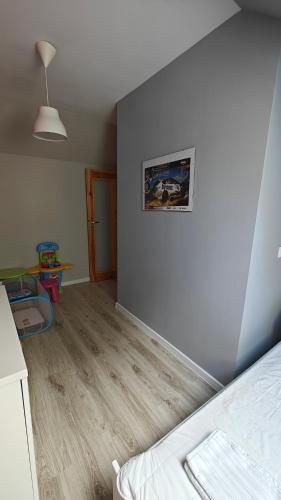 Una cama o camas en una habitación de Domek na Kaszubach - Brzozowy Raj Kaszubska Ostoja