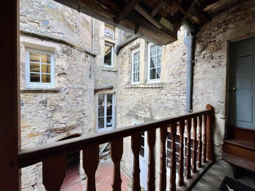 an outside view of a building with a balcony at La Chambre du Chateau - Center of Carentan in Carentan
