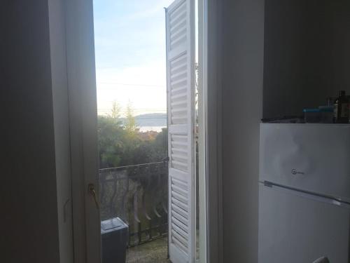 an open door to a balcony with a view at Villa with Pool&Garden 8 in Meina