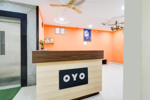 an office with an oro sign on a counter at Hotel O Sangareddy Formerly Ragas Grand in Patancheru
