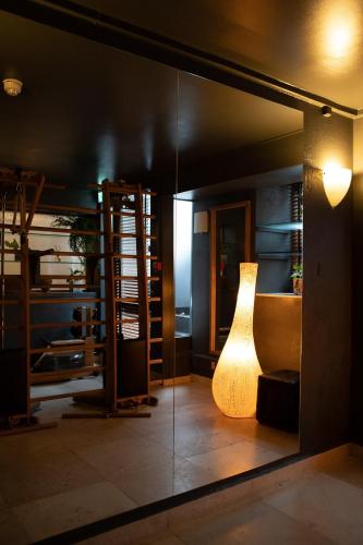 a room with a lamp in the middle of a room at Axel Guldsmeden in Copenhagen