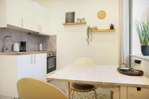 a kitchen with a table and chairs in a room at Palstek in Eckernförde