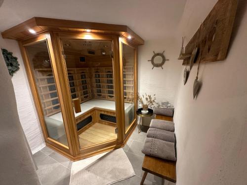 a large wooden cabinet in a room with stairs at Ferienhaus Krallinger in Abtenau
