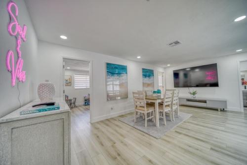 a dining room and living room with a table and chairs at Kids-Friendly Central Cape Coral Gem in Cape Coral